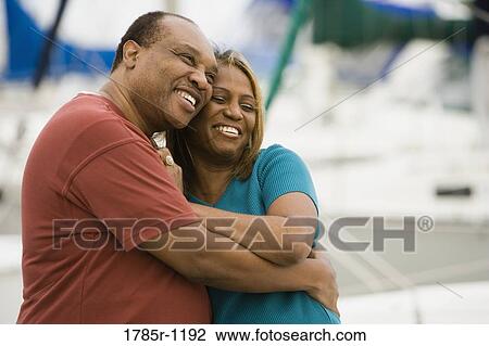 Stock Image - Mature African American couple embracing. Fotosearch