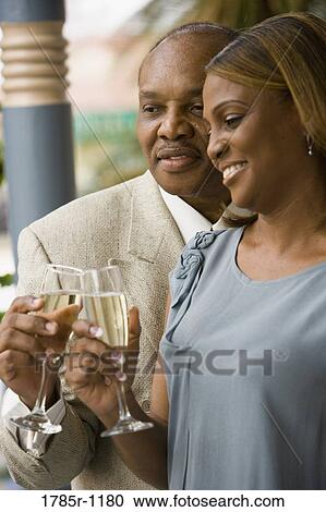 Mature African American couple celebrating with champagne View Large Photo Image Stock Image - Mature African American couple celebrating with champagne. Fotosearch