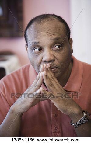 Mature African American man thinking View Large Photo Image Stock Photograph - Mature African American man thinking. Fotosearch