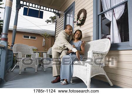 Picture - Mature couple hugging and smiling. Fotosearch