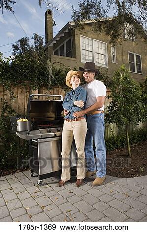 Mature couple standing together near barbeque grill View Large Photo Image Stock Photo - Mature couple standing together near barbeque grill. Fotosearch