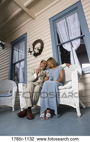 Mature couple toasting with champagne View Large Photo Image Stock Image - Mature couple toasting with champagne. Fotosearch