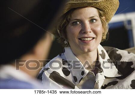 Mature couple wearing cowboy hats talking View Large Photo Image Stock Photography - Mature couple wearing cowboy hats talking. Fotosearch