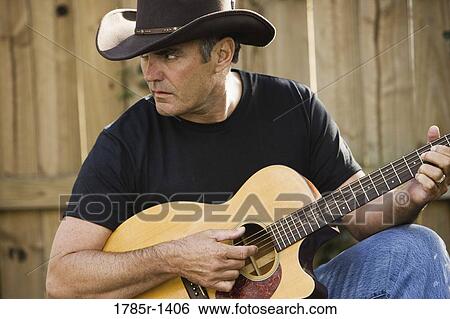 Mature man playing guitar, country music View Large Photo Image Stock Photograph - Mature man playing guitar, country music. Fotosearch