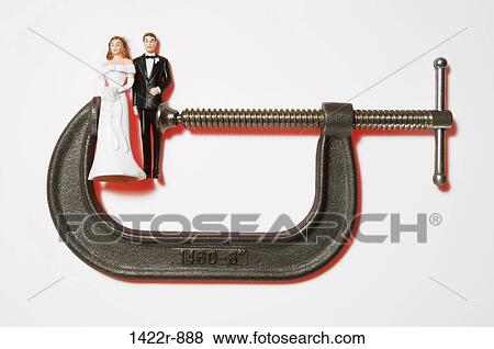 Miniature wedding figures in a metal clamp View Large Photo Image Stock Photo - Miniature wedding figures in a metal clamp. Fotosearch