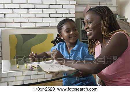 Mother and daughter coloring View Large Photo Image Stock Photo - Mother and daughter coloring. Fotosearch