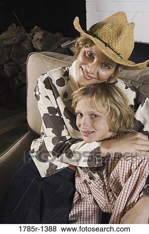 Mother embracing son View Large Photo Image Stock Photo - Mother embracing son. Fotosearch