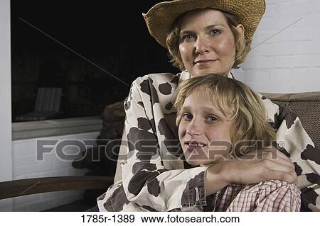 Mother embracing son View Large Photo Image Stock Photo - Mother embracing son. Fotosearch