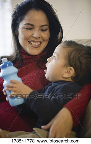 Stock Photo - Mother holding little boy. Fotosearch