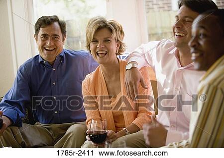 Parents chatting with adult son and friend View Large Photo Image Stock Image - Parents chatting with adult son and friend. Fotosearch
