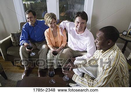 Parents chatting with adult son and friend View Large Photo Image Stock Photo - Parents chatting with adult son and friend. Fotosearch