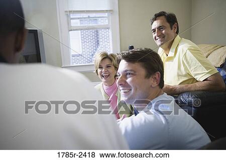 Parents chatting with adult son and friend View Large Photo Image Stock Photo - Parents chatting with adult son and friend. Fotosearch