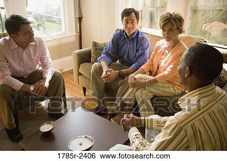 Parents chatting with adult son and friend View Large Photo Image Stock Photograph - Parents chatting with adult son and friend. Fotosearch
