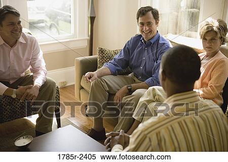 Parents chatting with adult son and friend View Large Photo Image Stock Photography - Parents chatting with adult son and friend. Fotosearch