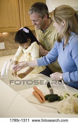 Parents helping their daughter to wash hands View Large Photo Image Stock Image - Parents helping their daughter to wash hands. Fotosearch