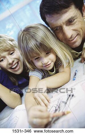 Parents playing with their daughter View Large Photo Image Stock Photograph - Parents playing with their daughter. Fotosearch