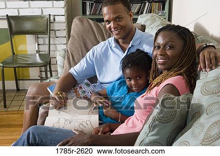 Parents reading and coloring with daughter View Large Photo Image Stock Image - Parents reading and coloring with daughter. Fotosearch