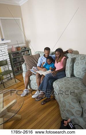 Parents reading and coloring with daughter View Large Photo Image Stock Photograph - Parents reading and coloring with daughter. Fotosearch