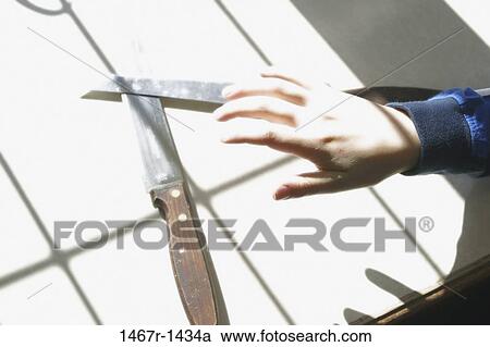 Person's hand over two knives View Large Photo Image Stock Image - Person's hand over two knives. Fotosearch