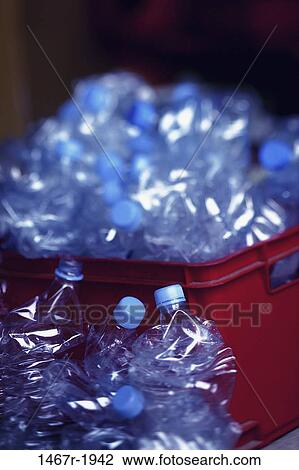 Stock Image - Plastic bottles in a garbage bin. Fotosearch