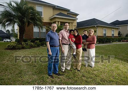 Portrait of a 3-generation family standing in backyard View Large Photo Image Stock Photo - Portrait of a 3-generation family standing in backyard. Fotosearch