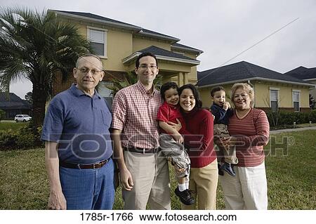 Portrait of a 3-generation family standing in backyard View Large Photo Image Stock Photograph - Portrait of a 3-generation family standing in backyard. Fotosearch