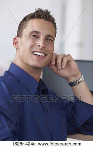 Portrait of a businessman smiling View Large Photo Image Stock Image - Portrait of a businessman smiling. Fotosearch