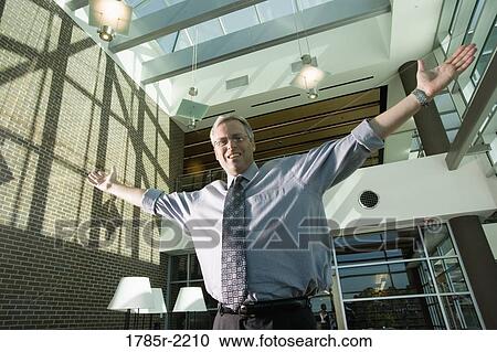 Portrait of a businessman with outstretched arms View Large Photo Image Stock Image - Portrait of a businessman with outstretched arms. Fotosearch