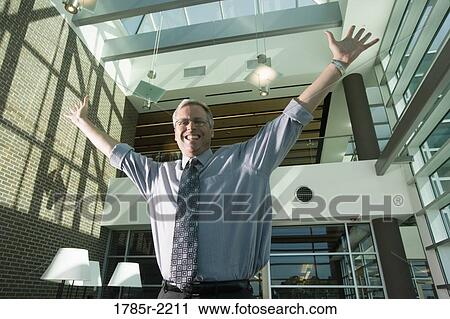 Portrait of a businessman with outstretched arms View Large Photo Image Stock Image - Portrait of a businessman with outstretched arms. Fotosearch