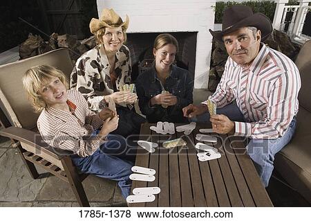 Portrait of a country family playing card game View Large Photo Image Stock Photo - Portrait of a country family playing card game. Fotosearch