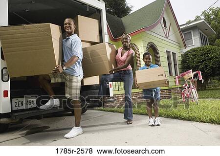 Portrait of a family unloading boxes from moving truck View Large Photo Image Stock Photo - Portrait of a family unloading boxes from moving truck. Fotosearch