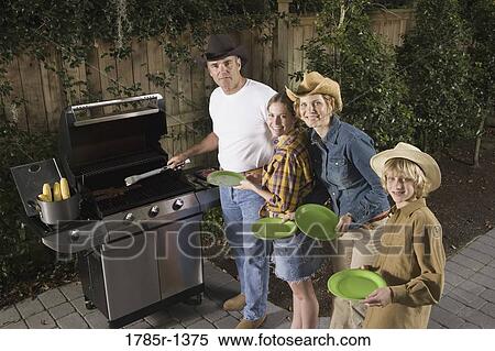 Portrait of a family waiting for food near barbeque grill View Large Photo Image Stock Photography - Portrait of a family waiting for food near barbeque grill. Fotosearch