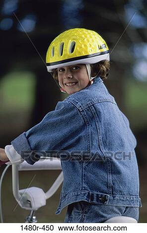 Portrait of a girl riding a bicycle View Large Photo Image Stock Image - Portrait of a girl riding a bicycle. Fotosearch