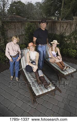 Portrait of a happy American family on deck chairs View Large Photo Image Stock Photo - Portrait of a happy American family on deck chairs. Fotosearch