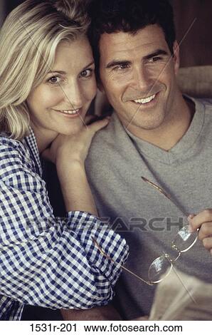 Portrait of a mid adult couple smiling View Large Photo Image Stock Image - Portrait of a mid adult couple smiling. Fotosearch