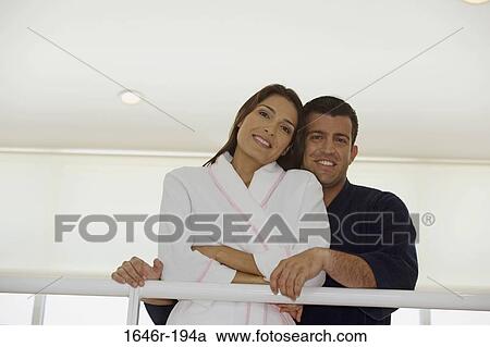 Stock Image - Portrait of a mid adult couple smiling. Fotosearch