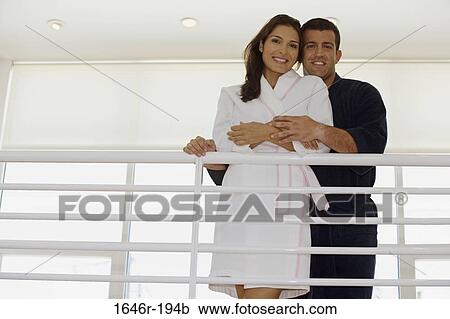 Portrait of a mid adult man embracing a mid adult woman and smiling View Large Photo Image Stock Image - Portrait of a mid adult man embracing a mid adult woman and smiling. Fotosearch
