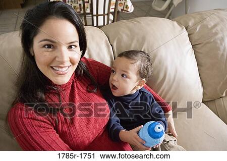 Stock Image - Portrait of a mother sitting with her son. Fotosearch