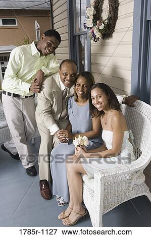 Portrait of a smiling family View Large Photo Image Stock Photo - Portrait of a smiling family. Fotosearch