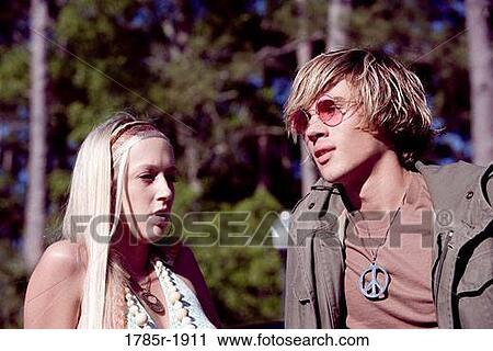Portrait of a young couple in vintage 1960's hippie costumes standing together View Large Photo Image Stock Image - Portrait of a young couple in vintage 1960's hippie costumes standing together. Fotosearch