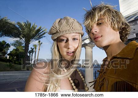 Portrait of a young couple in vintage 1960's hippie costumes View Large Photo Image Stock Photograph - Portrait of a young couple in vintage 1960's hippie costumes. Fotosearch