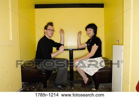 Portrait of a young couple smoking cigarettes View Large Photo Image Picture - Portrait of a young couple smoking cigarettes. Fotosearch