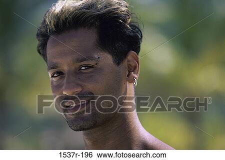 Portrait of a young man smiling View Large Photo Image Stock Photograph - Portrait of a young man smiling. Fotosearch