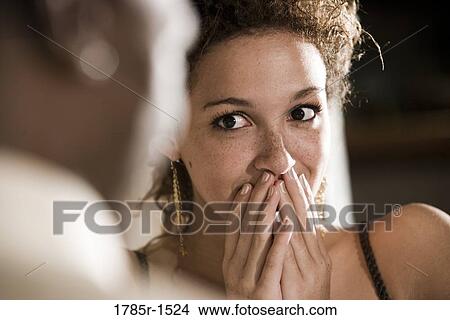 Portrait of a young woman showing pleasant surprise View Large Photo Image Picture - Portrait of a young woman showing pleasant surprise. Fotosearch