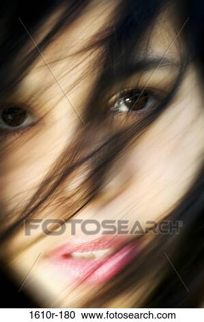 Portrait of a young woman staring View Large Photo Image Stock Image - Portrait of a young woman staring. Fotosearch