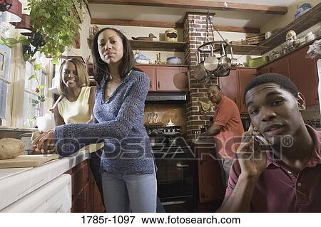 Stock Photo - Portrait of African American family in kitchen. Fotosearch