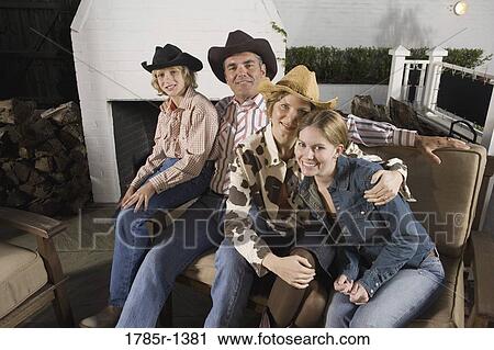Portrait of country family sitting on sofa View Large Photo Image Stock Image - Portrait of country family sitting on sofa. Fotosearch