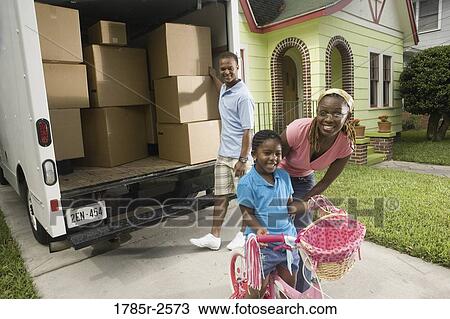 Portrait of family next to moving truck View Large Photo Image Stock Image - Portrait of family next to moving truck. Fotosearch