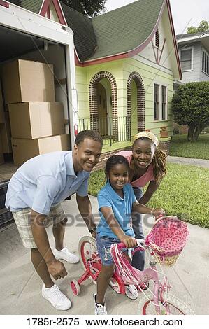 Portrait of family next to moving truck View Large Photo Image Stock Photography - Portrait of family next to moving truck. Fotosearch
