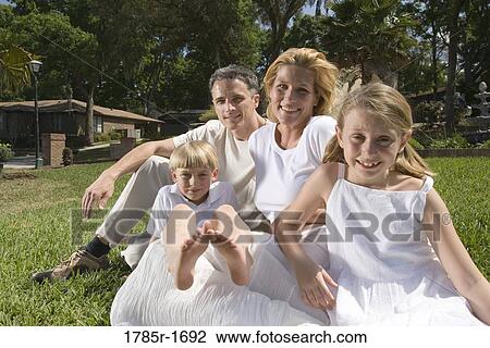 Portrait of family on front lawn View Large Photo Image Stock Image - Portrait of family on front lawn. Fotosearch